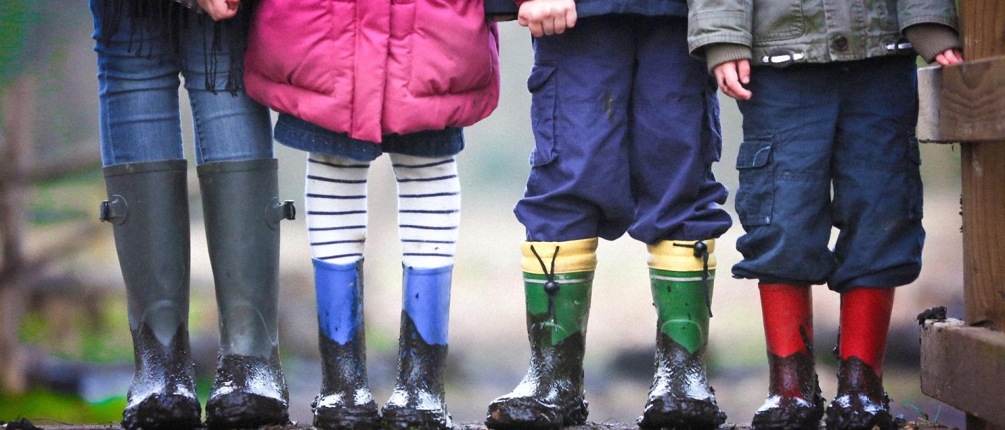 family in wellington boots